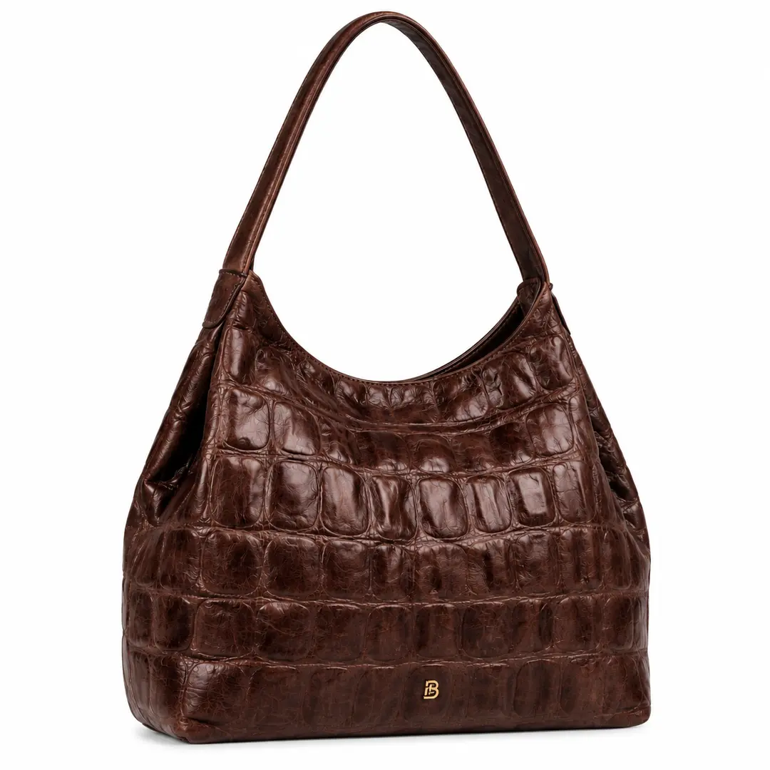 Belluga Croco Classy donkerbruine schoudertas met krokodillenreliëf, ruim hobo-model en goudkleurig logo.